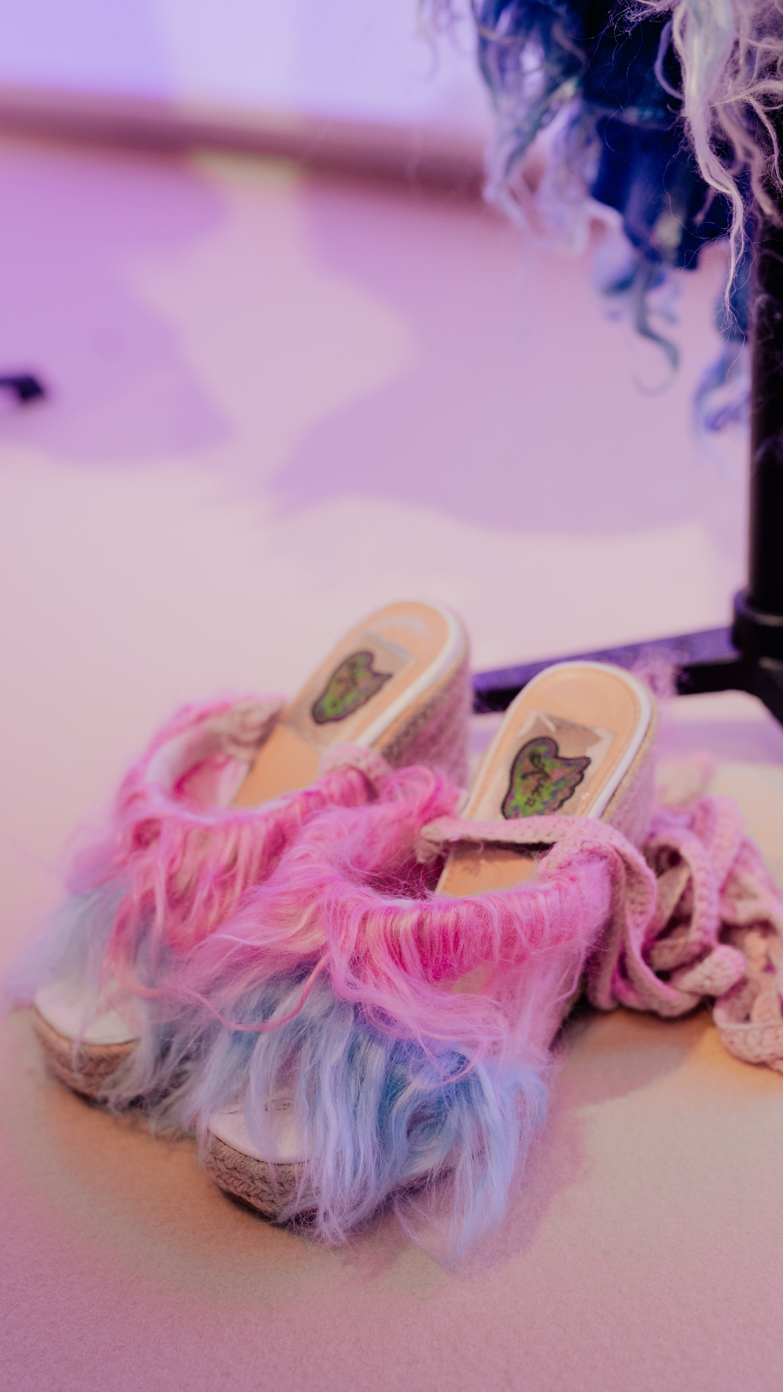 Look 1, LA ZARZAMORA wedges from REGENERATIVE FOLKLORE: Pink and purple fur implanted open-toe wedges with pink crochet straps, showcased at LVMH’s LIFE 360 Summit at UNESCO.